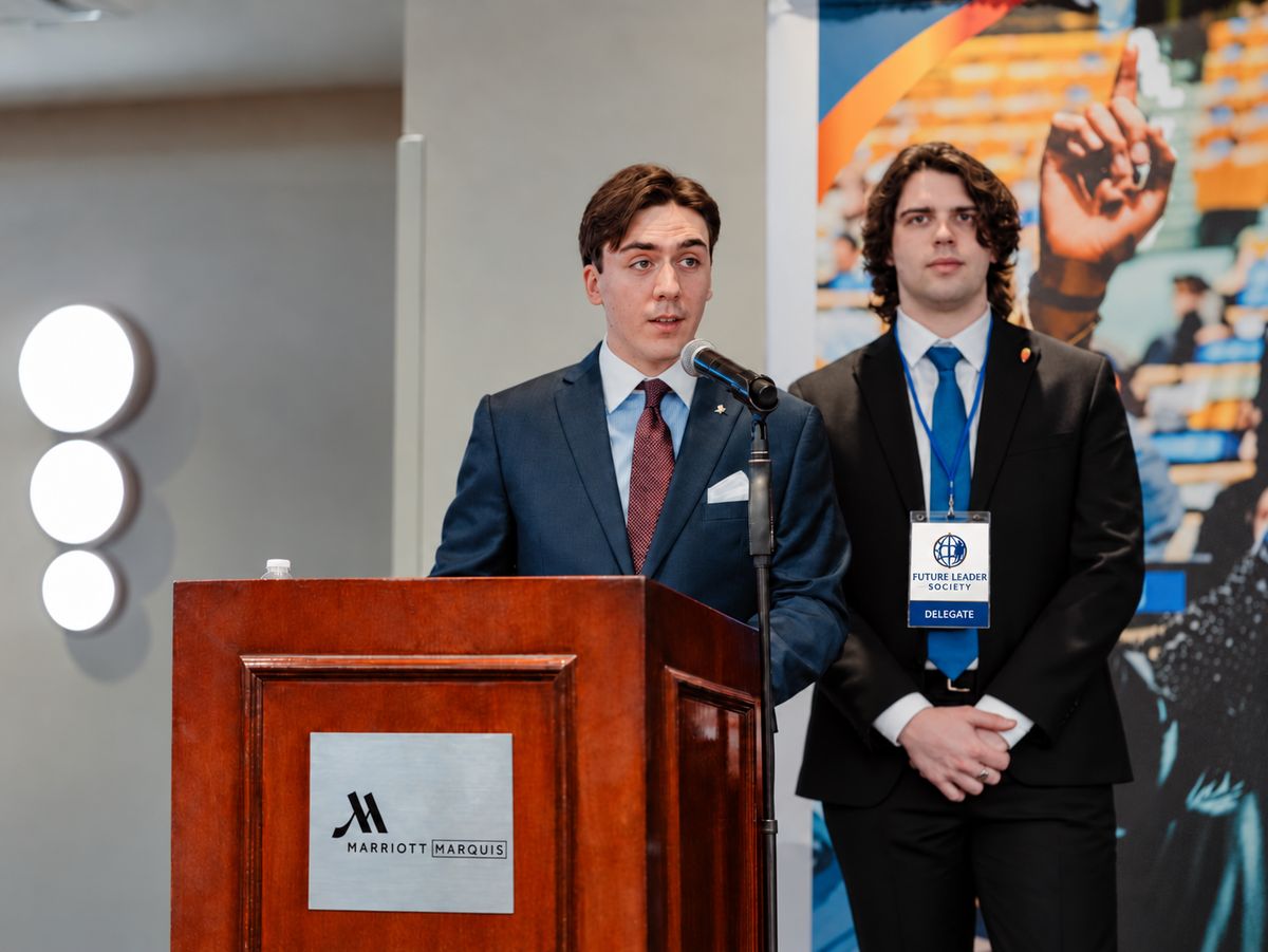 FLS delegates speaking at the podium